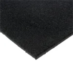 Close-up corner of a textured black rubber mat