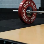 Close-up of a 25kg red BLK BOX competition plate