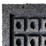 Close-up of black rubber tile drainage base.