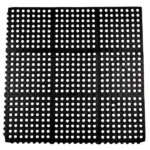 Overhead view of a black interlocking rubber floor mat