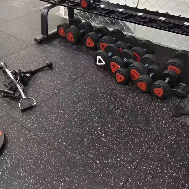 Speckled rubber gym flooring with dumbbell rack
