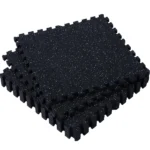 Top view of solid black textured interlocking floor tile