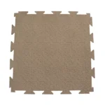 single tan interlocking foam tile with a non-slip surface.